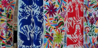 Venden cubrebocas chinos con diseños plagiados de bordados Tenangos