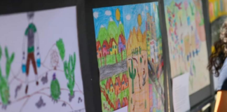 Niñas y niños expresan con pinturas su visión de la migración